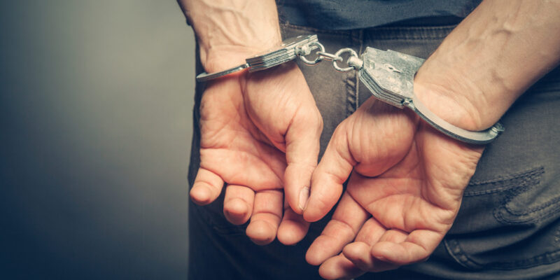 male hands in handcuffs